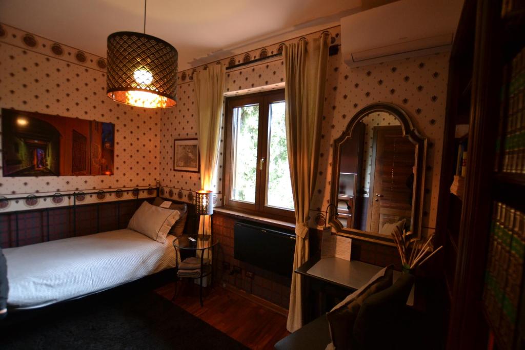 Postel nebo postele na pokoji v ubytování Triestè59 B&B