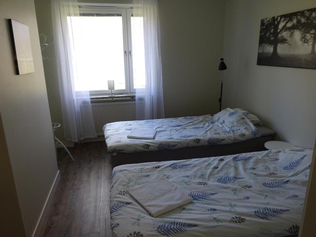 Postel nebo postele na pokoji v ubytování Ekbackens Vandrarhem