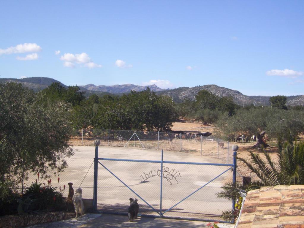 a basketball court in a park with people on it at Finca Gamundi in L'Ampolla