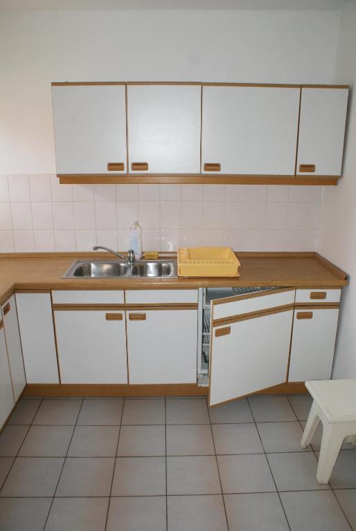 Kuchyňa alebo kuchynka v ubytovaní Apartamenty Drewniany Dom