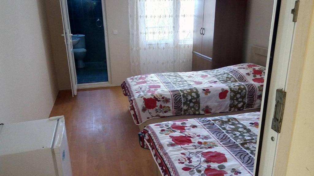 Postel nebo postele na pokoji v ubytování Mari Guest House