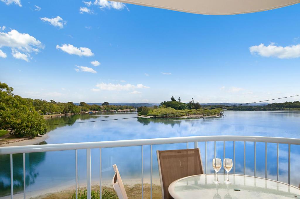 a balcony with a view of a river at Reflections Holiday Apartments in Maroochydore