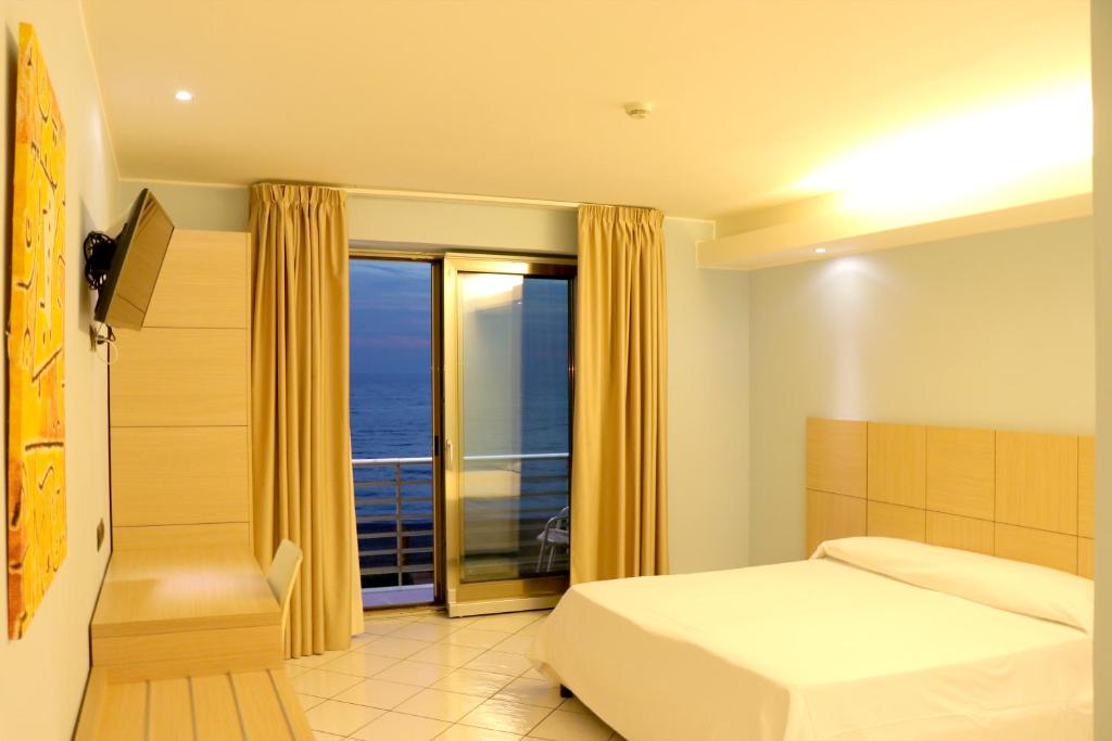 Postel nebo postele na pokoji v ubytování Hotel Ancora