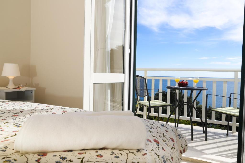 En eller flere senge i et værelse på Apartments Villa Lucy