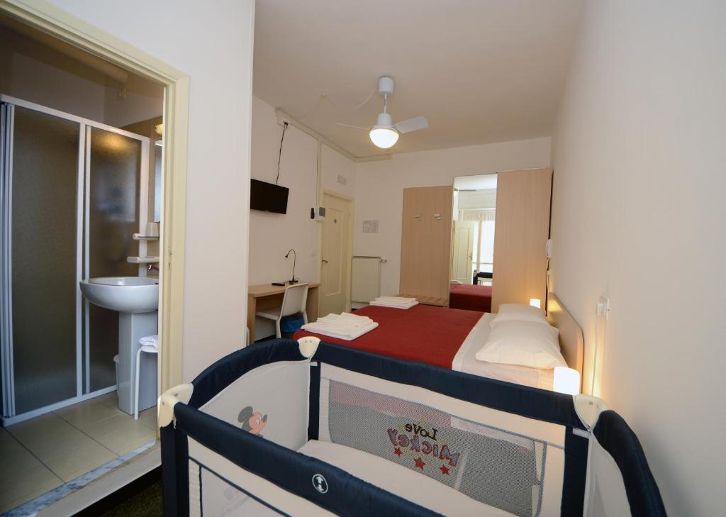 Łóżko lub łóżka w pokoju w obiekcie Locanda Marita