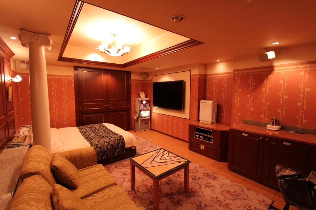 TV a/nebo společenská místnost v ubytování Hotel LaLa (Adult Only)