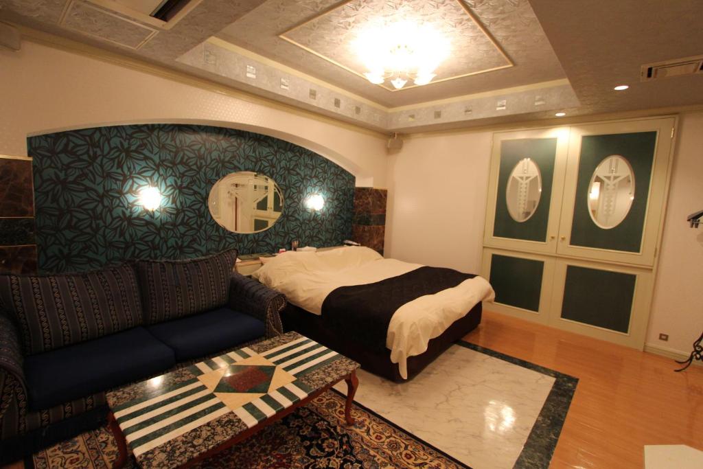 Postel nebo postele na pokoji v ubytování Hotel LaLa (Adult Only)