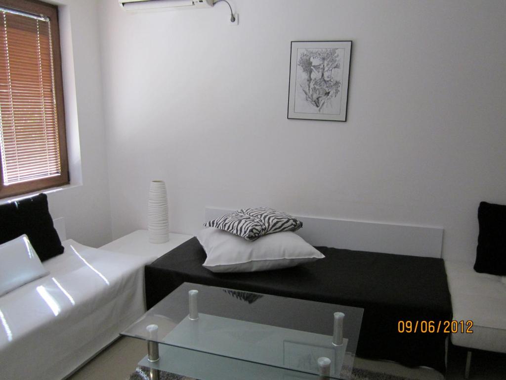 A bed or beds in a room at Bulhotel Pritzker Apartment