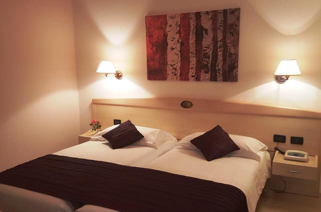 Postel nebo postele na pokoji v ubytování Hotel Da Remo