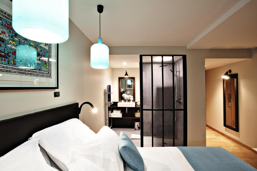 Postel nebo postele na pokoji v ubytování Boutique Hotel Villa du Taur