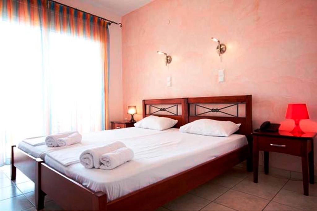 Postel nebo postele na pokoji v ubytování Esperanza Hotel
