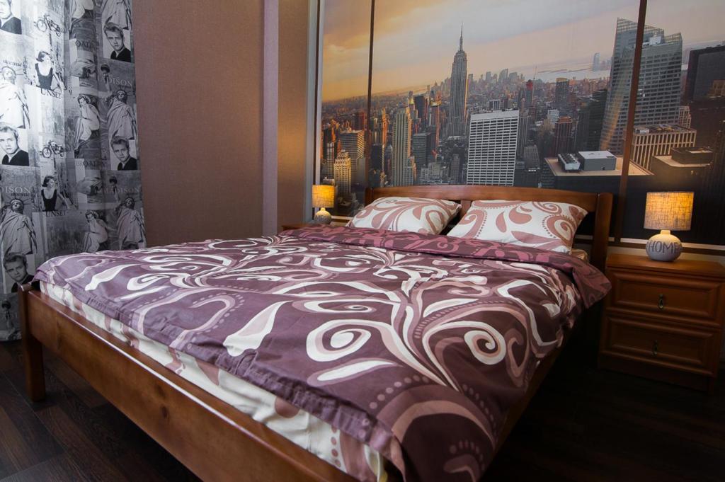 Säng eller sängar i ett rum på VIP Apartment on Shishkarevskaya