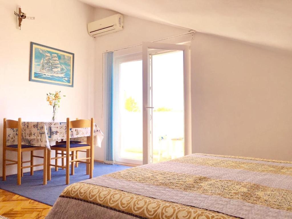 Postel nebo postele na pokoji v ubytování Apartment Martinovic