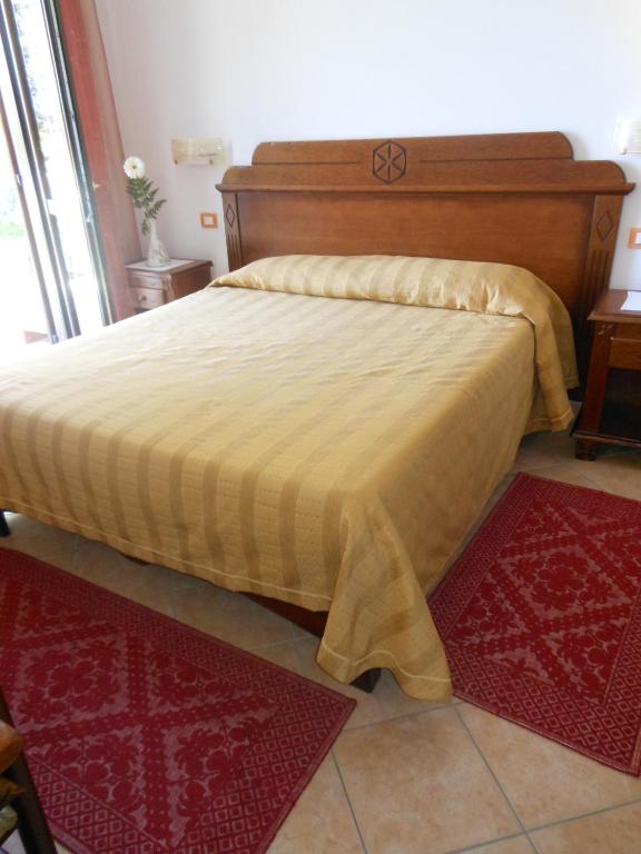 Postel nebo postele na pokoji v ubytování Hotel Ispinigoli