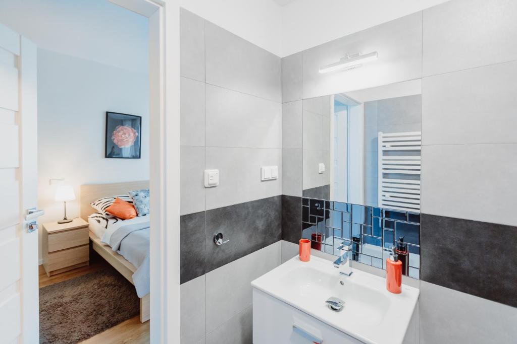 Posteľ alebo postele v izbe v ubytovaní Garden Apartment