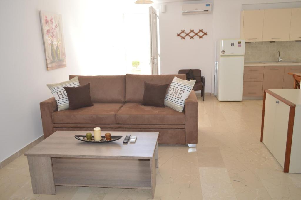 a living room with a couch and a coffee table at Anthi City Center Apartment in Rhodes Town