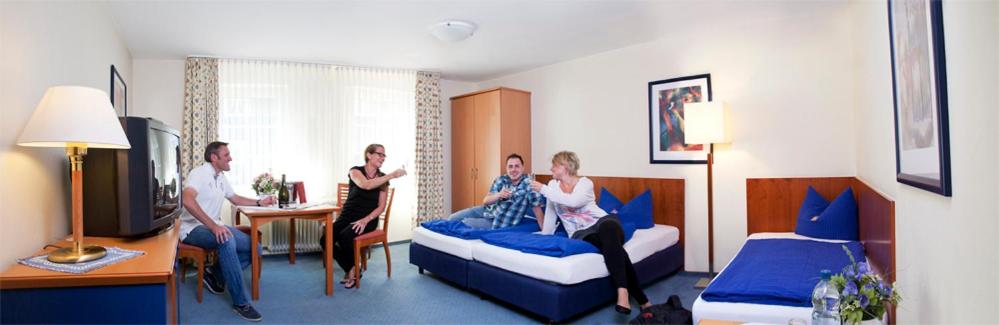 Postel nebo postele na pokoji v ubytování Hotel Willinger Mitte