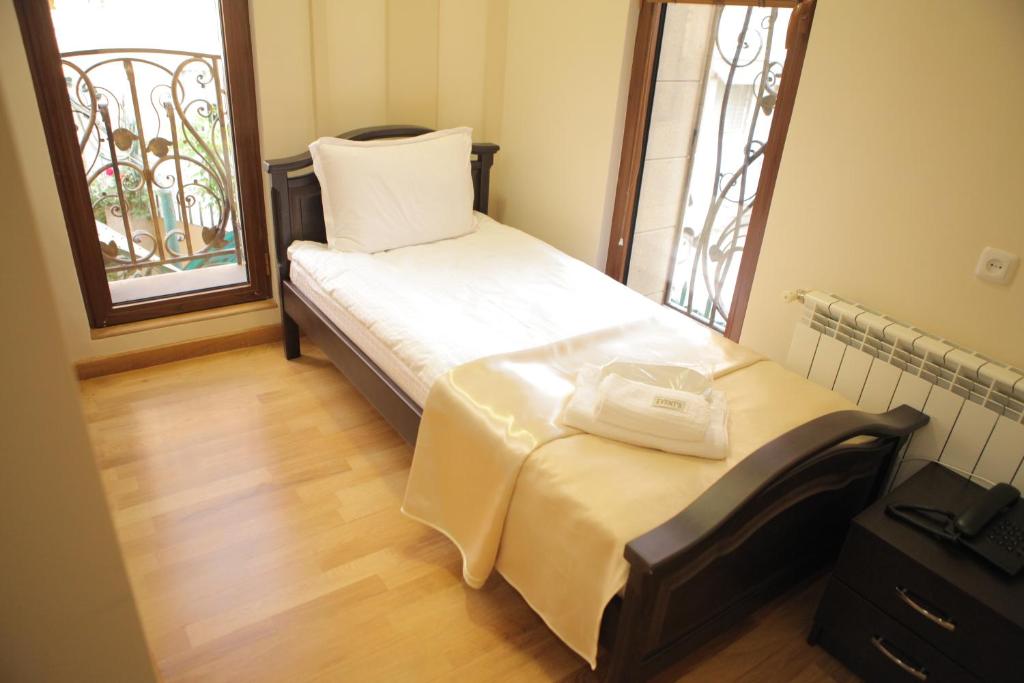 Postel nebo postele na pokoji v ubytování Daniel Boutique Hotel