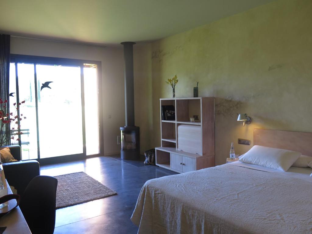 Postel nebo postele na pokoji v ubytování Hotel Fundació L'Olivar