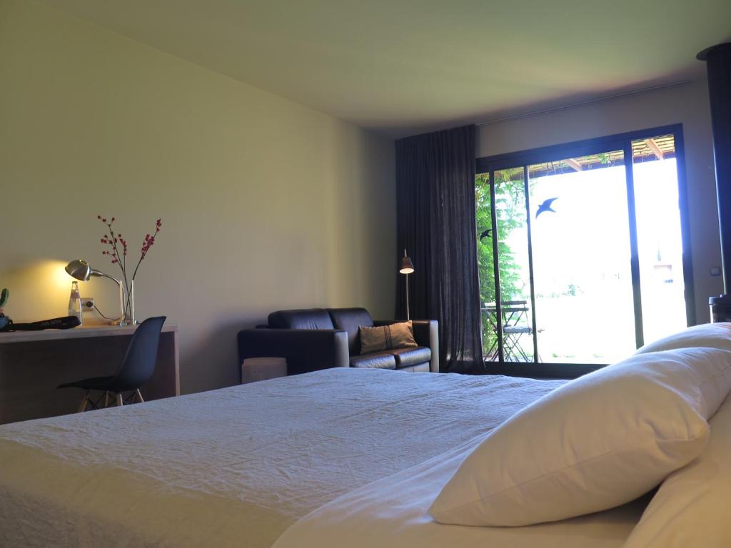 Postel nebo postele na pokoji v ubytování Hotel Fundació L'Olivar