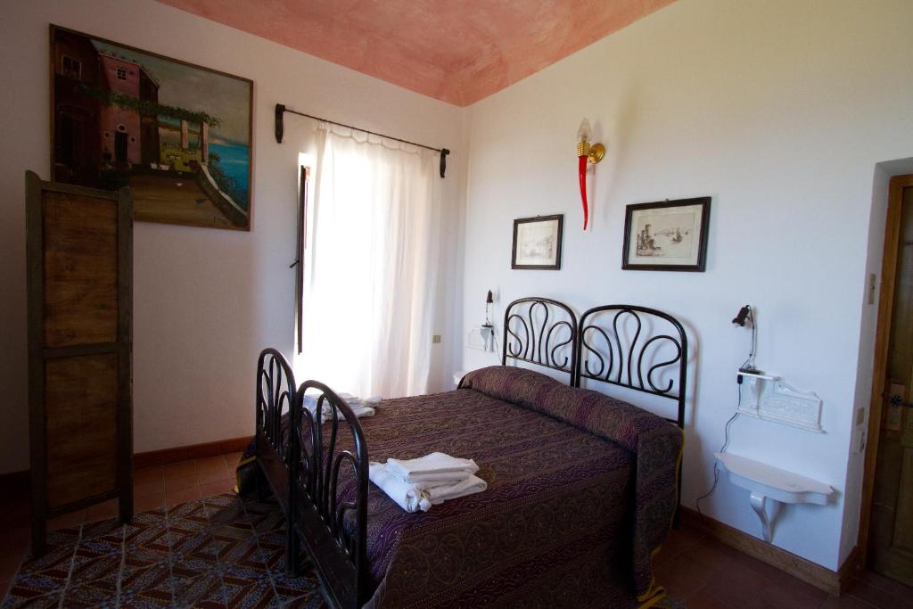 Postel nebo postele na pokoji v ubytování La Locanda del Barbablù
