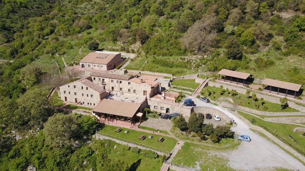 an aerial view of a large building on a hill at Masseria Rocca di Gonato in Castelbuono