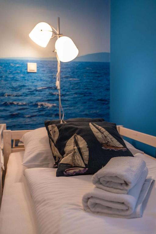 Postel nebo postele na pokoji v ubytování Apartments Faro & Mondo