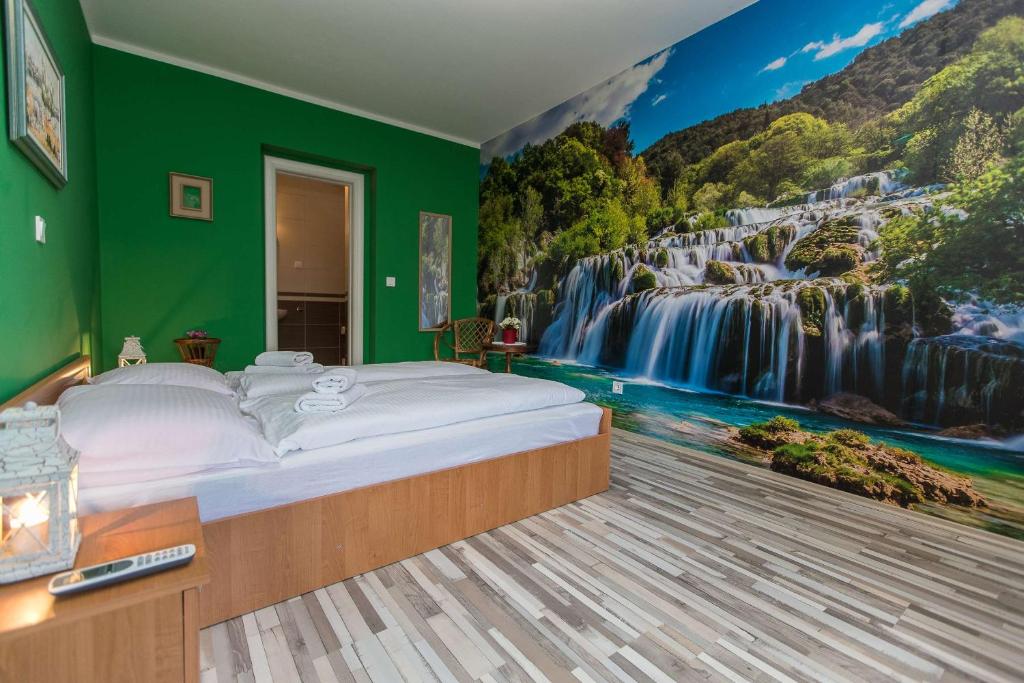 Postel nebo postele na pokoji v ubytování Apartments Faro & Mondo