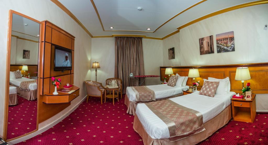 TV a/nebo společenská místnost v ubytování Amjad Al Deafah Hotel