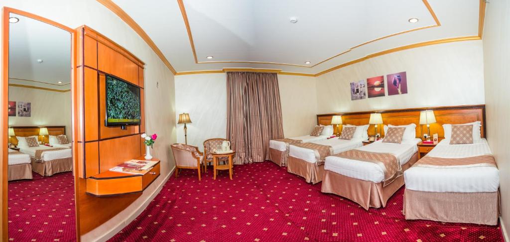 Postel nebo postele na pokoji v ubytování Amjad Al Deafah Hotel