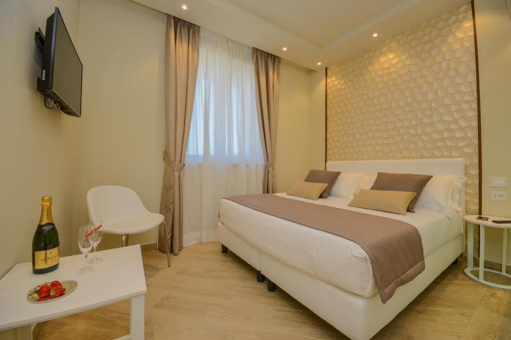 Posteľ alebo postele v izbe v ubytovaní Hotel Villa Garuti