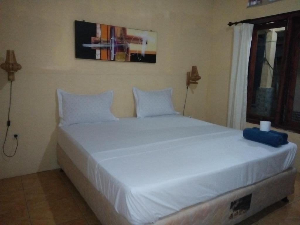 Postel nebo postele na pokoji v ubytování Izzi Homestay