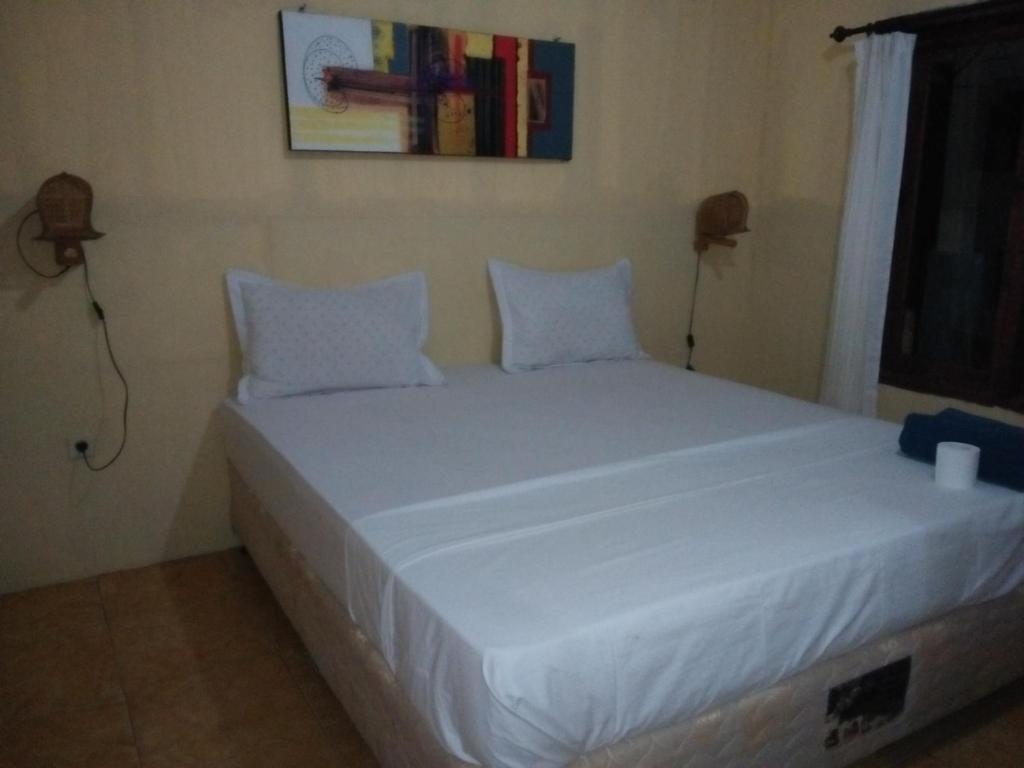 Postel nebo postele na pokoji v ubytování Izzi Homestay