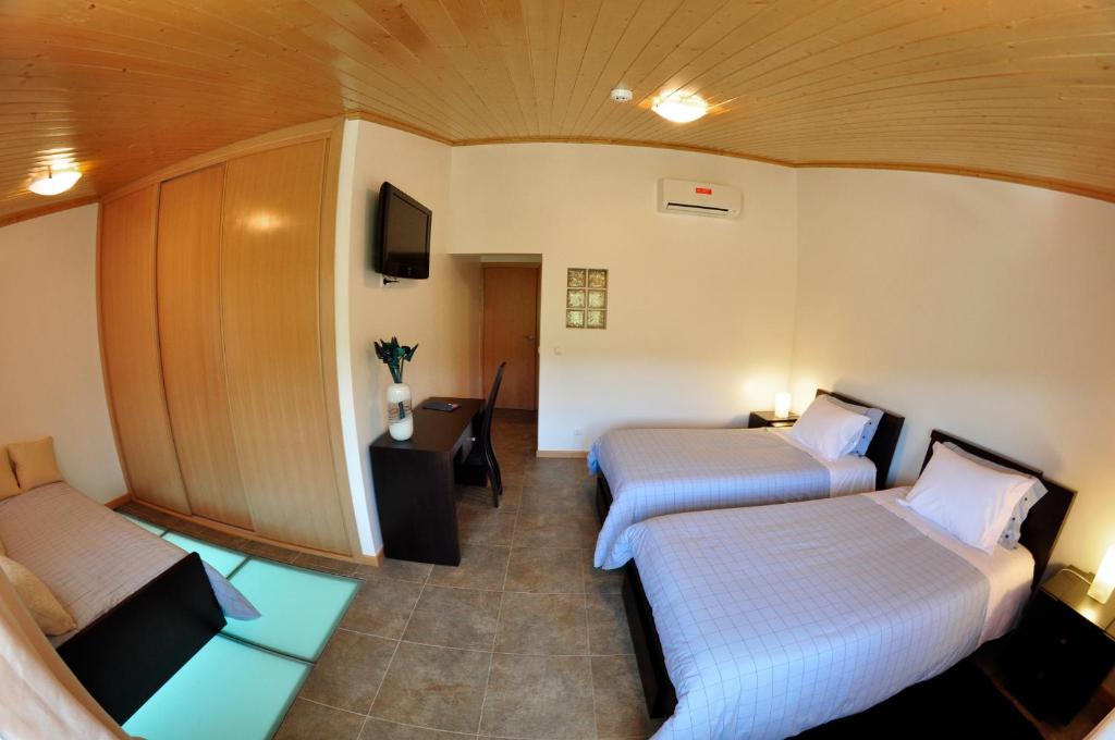 Uma cama ou camas num quarto em Casa dos Hospitalrios
