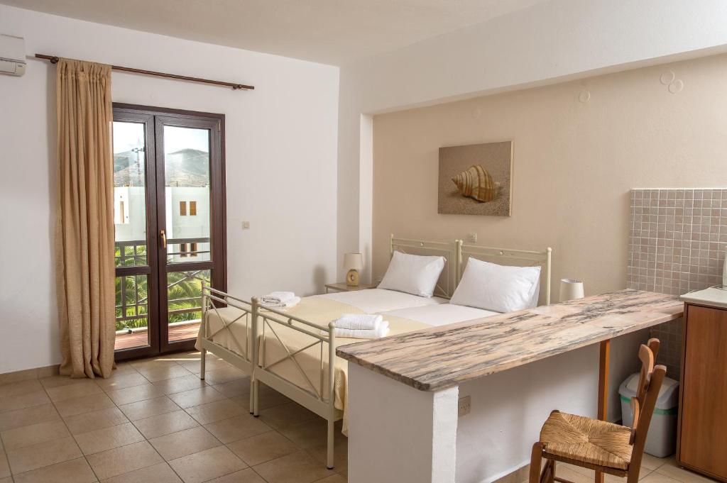 Postel nebo postele na pokoji v ubytování Joanna Apart - Hotel