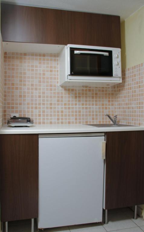 Kuchyň nebo kuchyňský kout v ubytování Hotel Idea