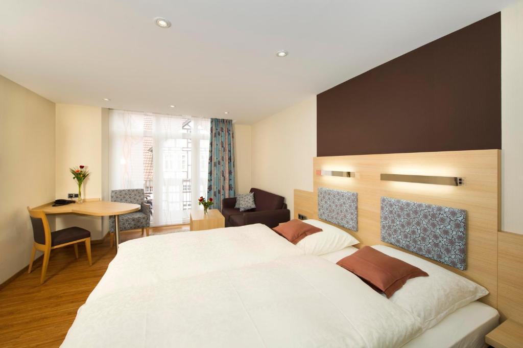 Postel nebo postele na pokoji v ubytování Hotel Storck