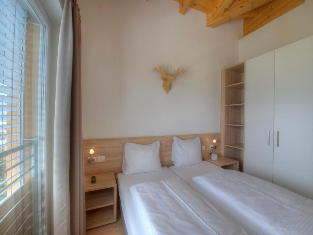 Posteľ alebo postele v izbe v ubytovaní Residenz Kitzsteinhornblick by Kaprun Rentals