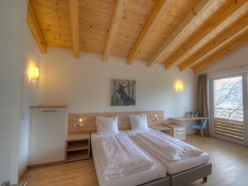 Posteľ alebo postele v izbe v ubytovaní Residenz Kitzsteinhornblick by Kaprun Rentals