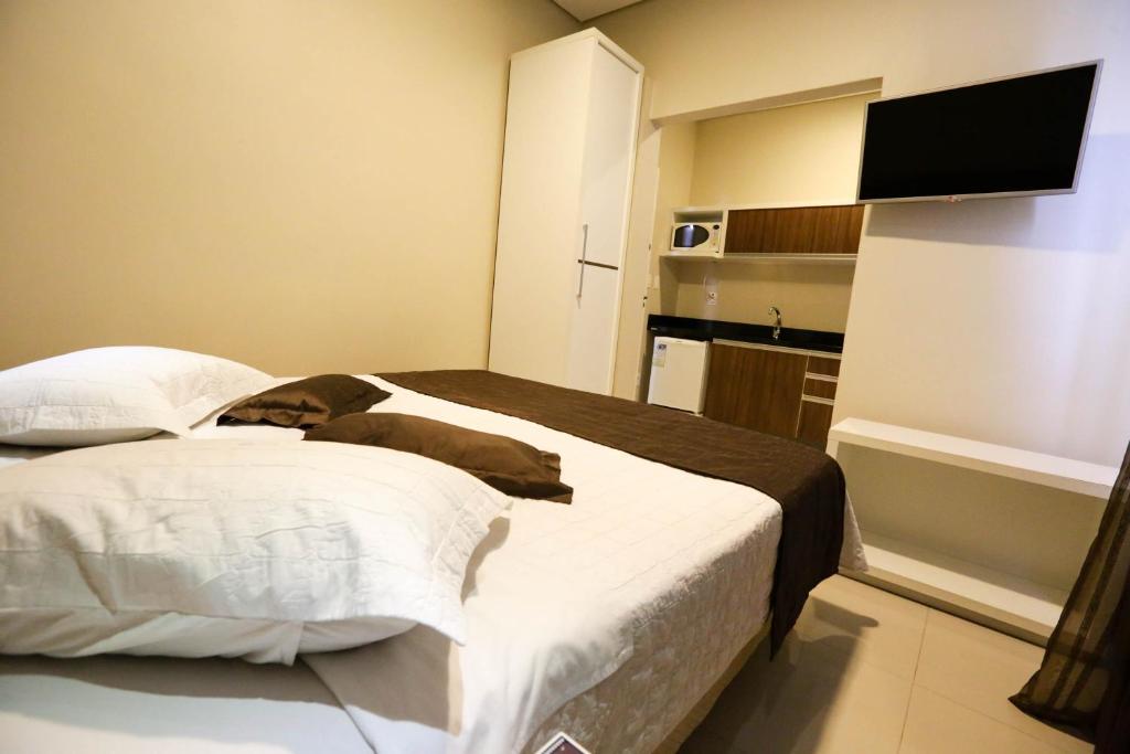 Postel nebo postele na pokoji v ubytování Hotel Emacite Flex
