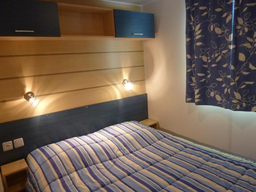 Postel nebo postele na pokoji v ubytování Camping Notre Dame