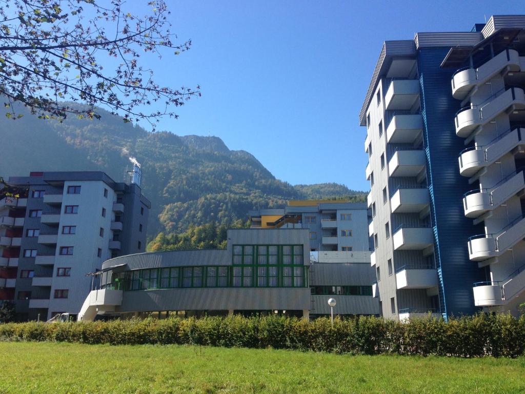 a group of buildings with a mountain in the background at Hotel Sommerhaus in Bad Ischl