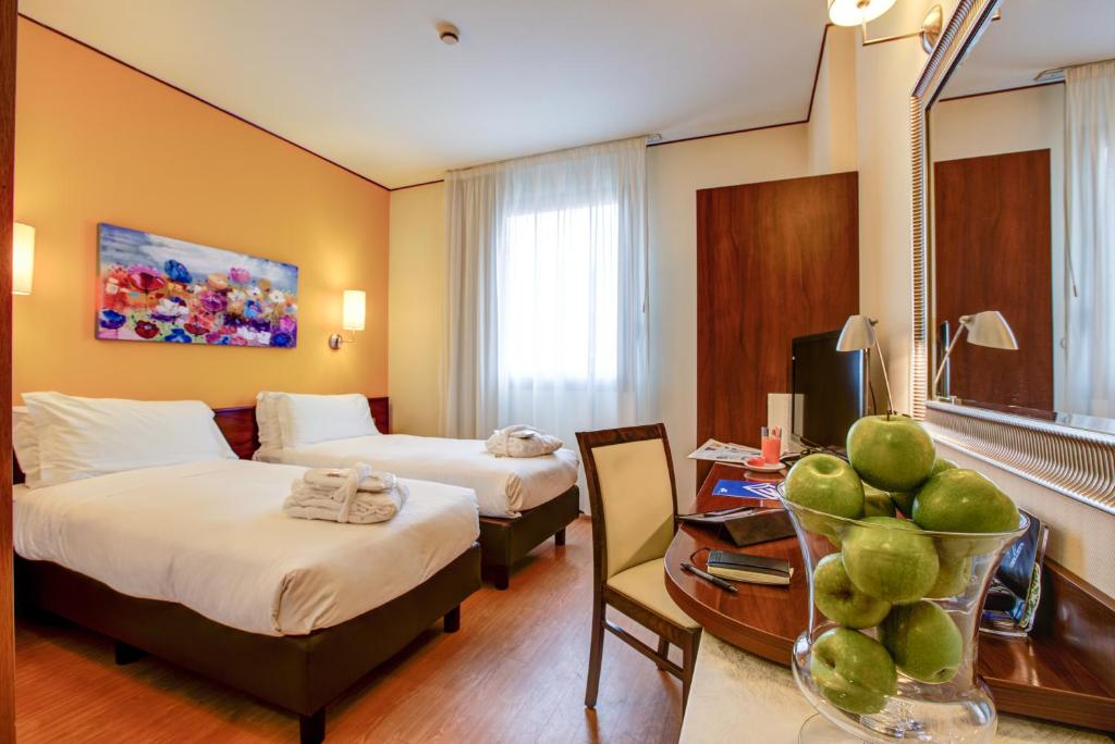 Postel nebo postele na pokoji v ubytování Hotel Europa