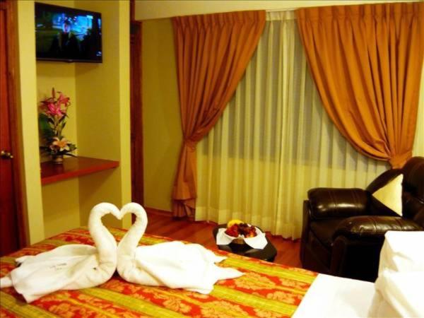 Postel nebo postele na pokoji v ubytování Hostal Los Andes