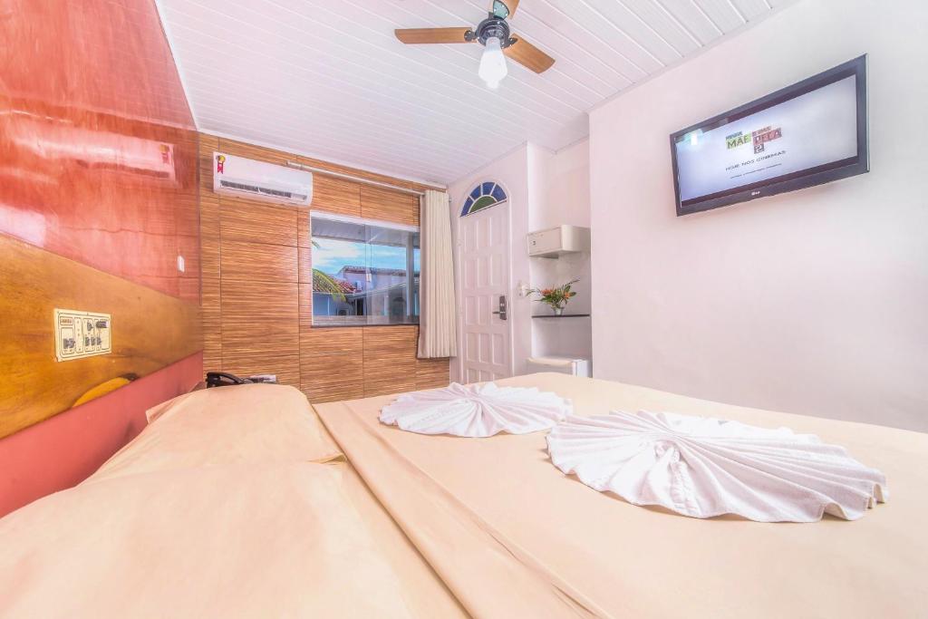 Postel nebo postele na pokoji v ubytování Shangrilá - Rede Soberano