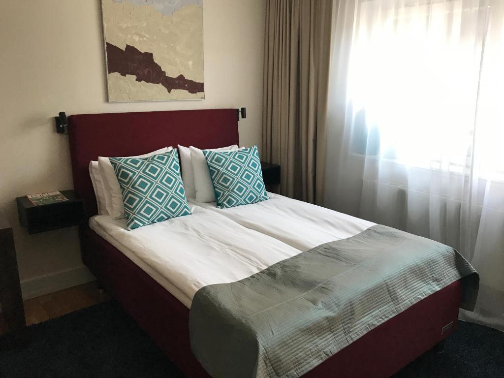 Postel nebo postele na pokoji v ubytování ProfilHotels Riddargatan