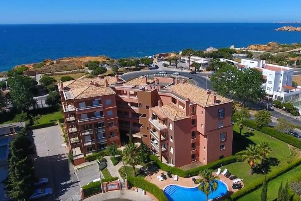 arial view of a building in front of the ocean at Litoral Mar in Portimão