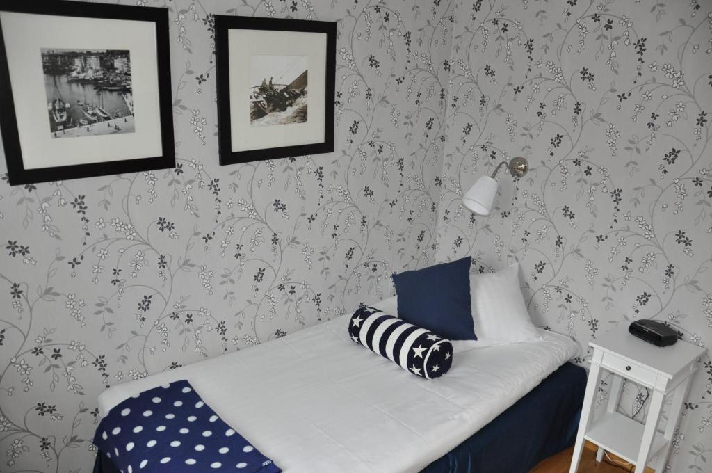 Postel nebo postele na pokoji v ubytování Strand Hotell