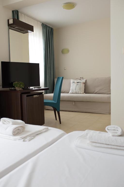 Postel nebo postele na pokoji v ubytování Ema Hotel