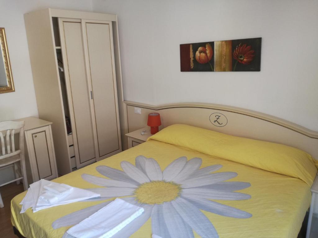 Postel nebo postele na pokoji v ubytování Hotel La Zorza
